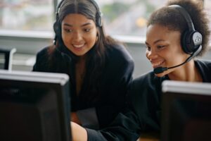 Two girls happy at work
